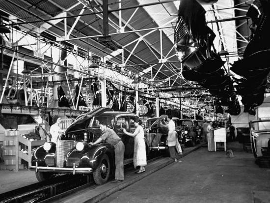Men and Women Polishing Chevrolets on the Assembly Line at the General Motors Plant
