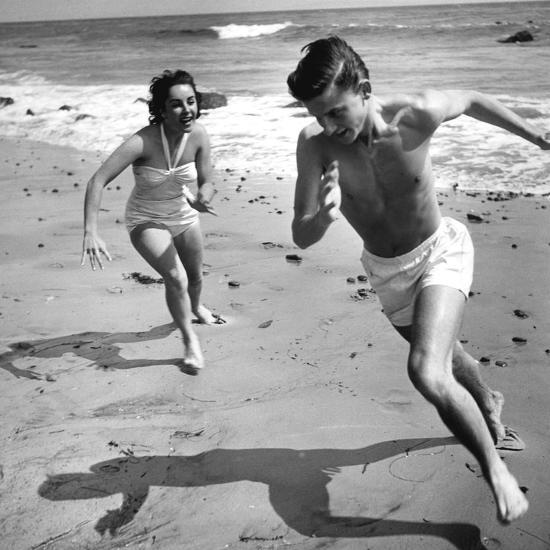 Elizabeth Liz Taylor and Roddy Mcdowall Playing on the Beach 1948