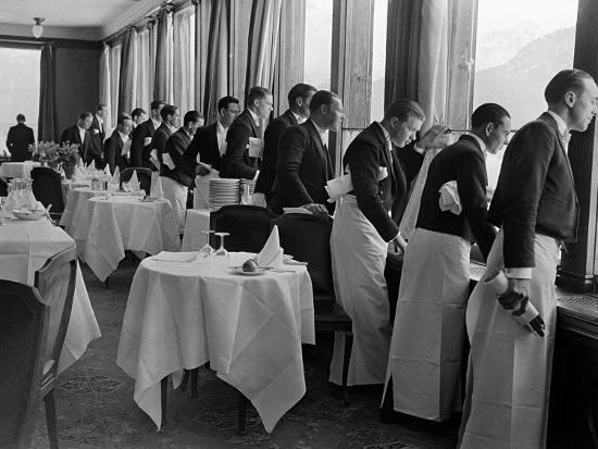 Waiters at the Grand Hotel Line Up at the Windows to Watch Sonja Henie Ice Skate Outside