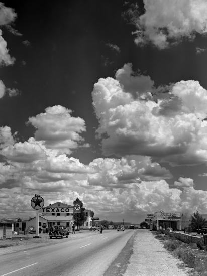 Cumulus Clouds Billowing over Texaco Gas Station along a Stretch of Highway US 66